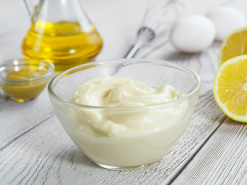 Mayonnaise and ingredients for cooking on the table